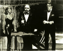 Joe Renzetti accepting his Academy Award flanked by Raquel Welch and Dean Martin.
