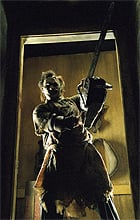 Leatherface takes position in the remake of Texas Chainsaw Massacre. Photo by Van Redin, Courtesy of New Line Productions.