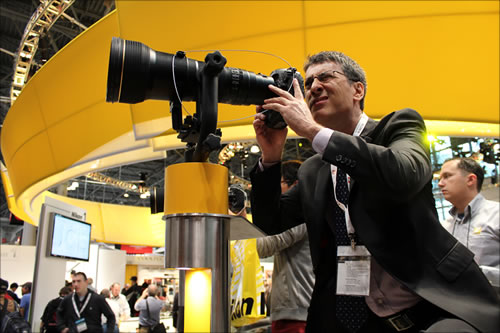 Pictured: Kim Welch, Publisher/Editor-in-Chief of StudentFilmmakers.com + StudentFilmmakers Magazine, drops by the Nikkor Lenses booth at PhotoPlus Expo, Manhattan, New York; photo by Jody Michelle Solis.