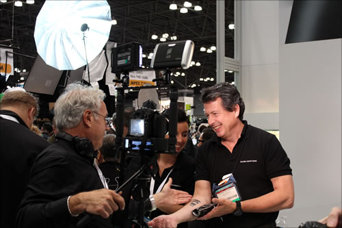 Pictured: Richard Schleuning, National Sales Manager, International Sales Americas, Camera Lens Division, Carl Zeiss AG, (right).; PhotoPlus Expo, Manhattan, New York; photo by Jody Michelle Solis.
