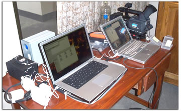 (Pictured) Off-loading set up back in the Moreau House (the crew’s base and the Holy Cross ‘HQ’) in the city of Dhaka. MacBook Pro and Powerbook G4 moving footage from cards to drives and finally to the 2TB Raid.