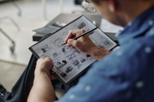 Sketches on Paper in Male Hands